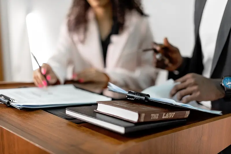 Corporate Law Attorney image with more focus on corporate law books